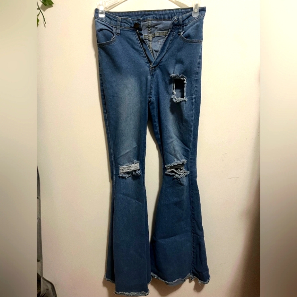 Ripped light wash flare jeans